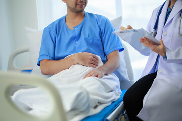 Doctor talking with patient in hospital, The doctor is explaining information about various...