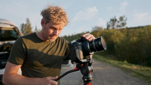 Sun-kissed Filmmaker Recording A Tilt Shot