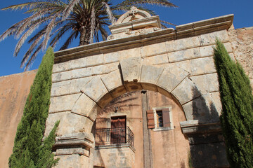 stone arch in an orthodox monastery (arkadi) in crete in greece 