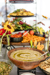 Fancy Bowl of Hummus in Wood Bowl on Buffet Table, Appetizer Display, Hors D'oeuvres Display