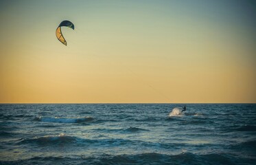 Beauty Photo of a Surfer away on a board in the open sea against a clear sky - Powered by Adobe