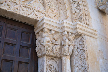 Obraz premium Detailed view of ornate stone carvings of the Church of San Leonardo in Manfredonia, Italy