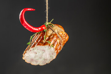 smoked Chicken roll on a dark background. copy space for text