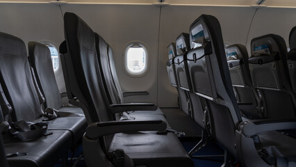 Empty airplane seats in the cabin