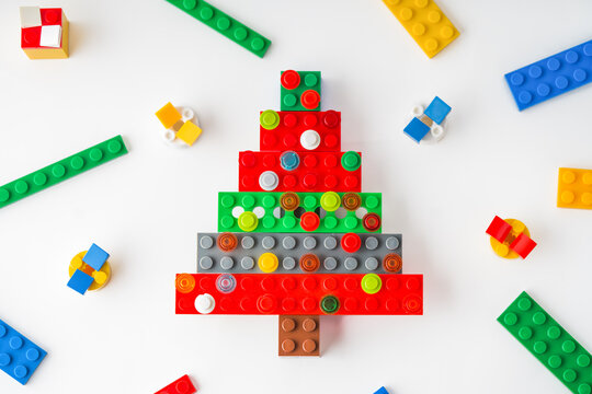 Festive Toy-Built Scene: Gifts, and Christmas Tree Made from Bright plastic constructor. Happy New Year and Merry Christmas. Holidays concept. Lego blocks. Novosibirsk, Russia - October 27, 2023.