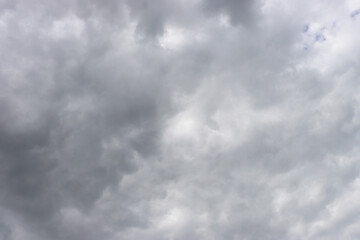 Obraz premium Abstract background from gray cloudy sky.