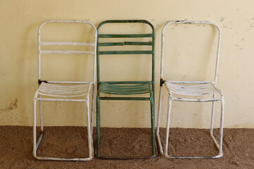 Old iron chair, white and green