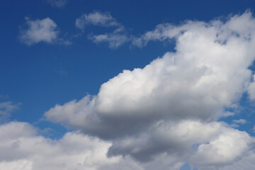 Blue sky with a large white cloud.