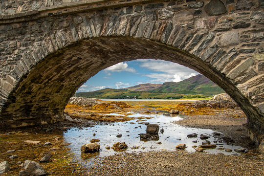 old arch bridge over the river