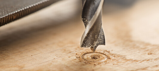 metal drill bit make holes in wooden oaks plank