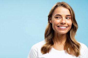Closeup portrait beautiful smiling young woman with white healthy teeth and stylish wavy hair...