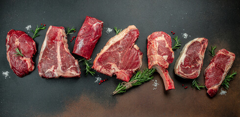 Raw Variety of fresh black angus prime meat steaks, Long banner format. top view. copy space for text