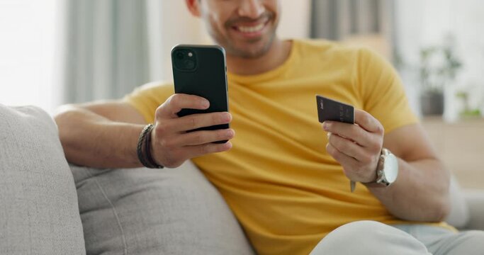 Hands, credit card and phone on sofa for online shopping, e commerce payment or internet subscription at home. Happy man relax on couch with mobile app banking, loan or sign up for streaming service