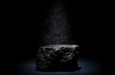 black stones on a dark background for the podium, product presentation.