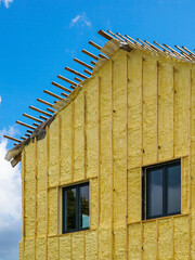 The facade of the residential house sprayed with a layer of polyurethane thermal insulation foam
