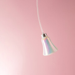 Christmas decoration bell in motion. Minimal New Year's concept.