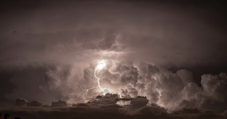 Dramatic dark sky with lightning. Concept on the theme of weather, natural disasters, storms,...