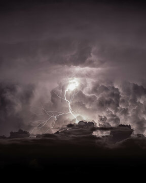 Dramatic dark sky with lightning. Concept on the theme of weather, natural disasters, storms, typhoons, tornadoes, thunderstorms, lightning.