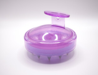Purple massage brush for body and hair