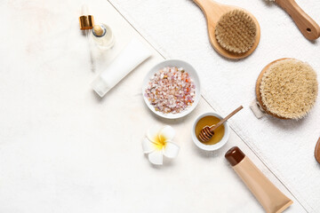 Composition with spa supplies and cosmetics on light background