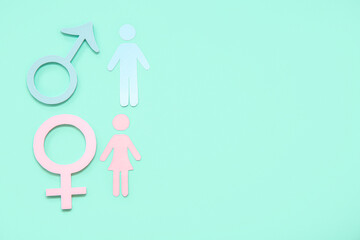 Female and male gender symbols with figures on turquoise background