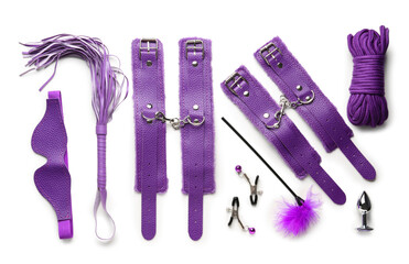 Purple sex toys on white background