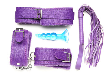 Purple sex toys on white background