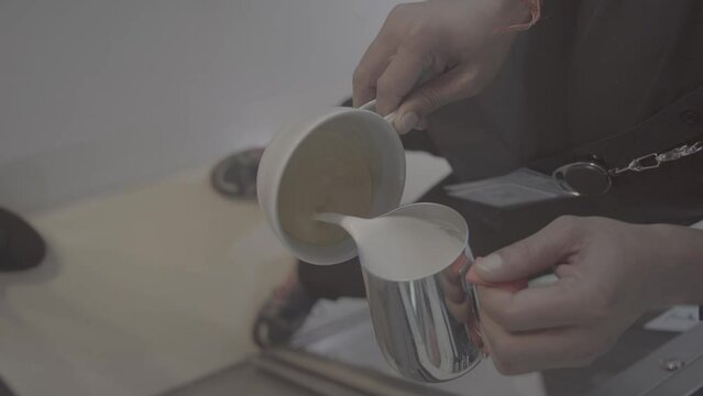 person  doing something with coffee