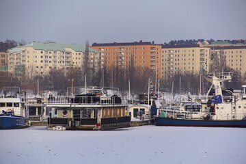 View of marina at harbor during winter - Powered by Adobe