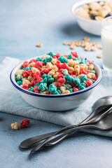 The concept of a healthy breakfast of vegetarian yogurt, whole grain cereal fresh fruit on a blue table against a white kitchen background. Front view.
