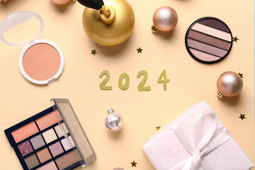 Christmas composition with different makeup products and gift box on beige background