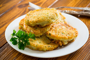 cooked fried potato cutlets with herbs