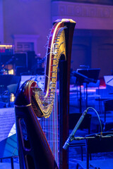 harp on stage in a concert hall