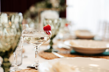 a shot of a decorated wedding table with food and drinks, wedding table settings
