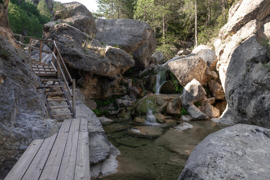 Wooden path over Matarrana river at The Parrizal spot in Beceite, Teruel, Spain