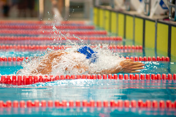 Swimmer swims breaststroke swimming style in the pool - 681806448