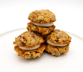Close up photo of oatmeal cream pie cookies with walnuts and chocolate chips and buttercream filling