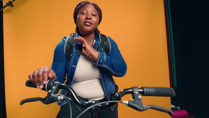 Video showcasing african american bike messenger happily explaining about her courier service job....