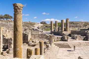 Columns at the Roman ruins of Dougga, Tunisia. - obrazy, fototapety, plakaty