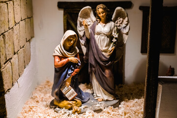 Figures of a classic nativity scene decorated with beautiful artistic traditional colors.