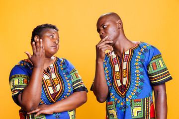 Pensive couple thinking while discussing complex idea and contemplating together. Thoughtful man...