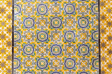 Yellow and blue decorative tiles on a house near the Tunis Souk.