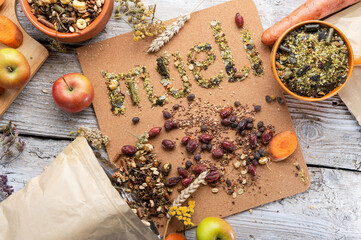 special muesli and granules for senior horses  served in bowl around muesli background.  . feeding...