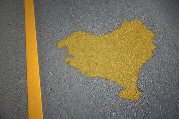 yellow map of basque country on asphalt road near yellow line.