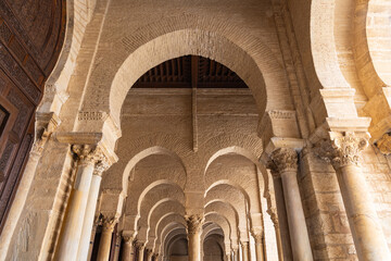 Exterior colonnade at the Great Mosque of Kairouan. - obrazy, fototapety, plakaty
