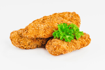 Breaded Chicken Inner Fillet on a White Background,Chicken Breaded Raw Meat.Chicken Breaded Fillet.Fast food. Fast cooking. Breaded chicken nuggets. Homemade food at home.