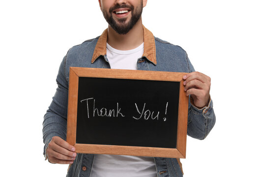 Man holding small chalkboard with phrase Thank You on white background, closeup
