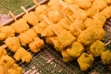 sticks with Japanese vegetable tempura on a grid