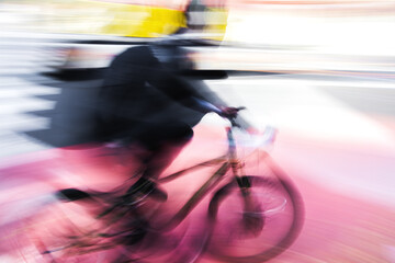 abstract photo of a cyclist in city traffic