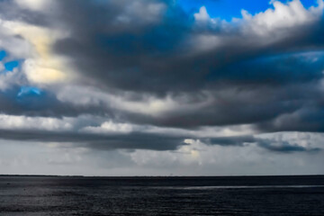 sky and clouds over lake